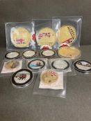A selection of various collectable photo coins and medallions