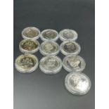 A selection of ten collectable coins, crowns various countries of issue.