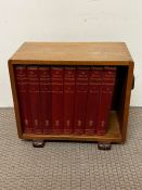 A light oak Art Deco book stand with eight "The book of Knowledge" Waverley