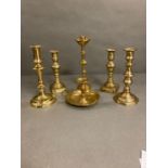 A selection of six brass candlesticks
