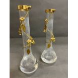 A pair of gilt bud vases