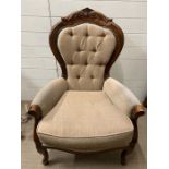A Victorian armchair with button back