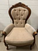 A Victorian armchair with button back