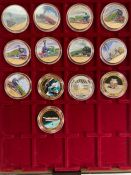 Two trays of collectable photo coins. Queens Coronation and Trains