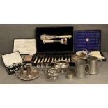 A selection of boxed cutlery sets and some silver plated items.