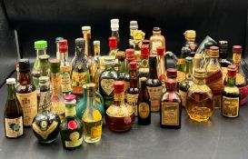 A collection of miniature bottle spirits and liqueurs including Johnie Walker whisky, port, brandy