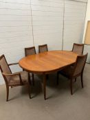 A Mid Century G Plan extending dining room table with six chairs