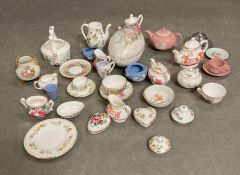 A selection of miniature tea sets etc various makers to include Coalport, Crown Staffs, Wedgwood