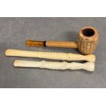 A corn pipe and two carved cigarette holders