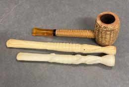 A corn pipe and two carved cigarette holders