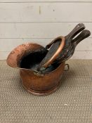A copper coal bucket and bellow