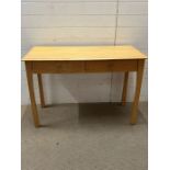 A contemporary desk with two drawers and a chair (H78cm W117cm D51cm)