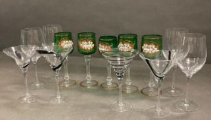 Eight wine glasses and a martini glass