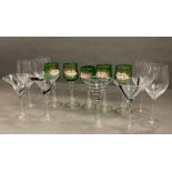 Eight wine glasses and a martini glass