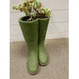 A garden planter in the form of Wellington boots