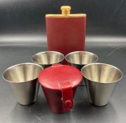 A Leather cased set of stirrup cups and gold plated hip flask