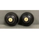 A pair of vintage lawn bowls