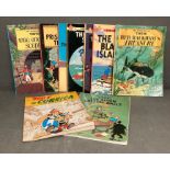 A selection of Tin Tin comics and Asterix comics/books