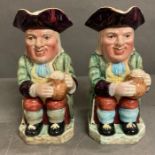 A pair of English Beswick toby jugs