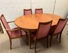 A six seater dining room table with four chairs and two carvers