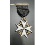 An Order of St John of Malta, hallmarked 1933 Gilded and enamelled Maltese cross.