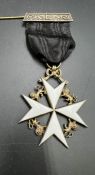 An Order of St John of Malta, hallmarked 1933 Gilded and enamelled Maltese cross.