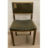 A George VI Coronation chair in limed oak with green velvet, stamped to base.