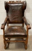 A 17th/18th Century Swedish Baroque leather covered wingback chair