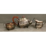 A silver tea service comprising tea pot, sugar bowl and milk jug by Poston Products Limited