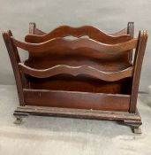 A mahogany magazine rack