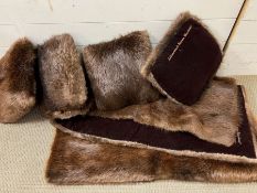 A luxurious fur throw and five fur cushions