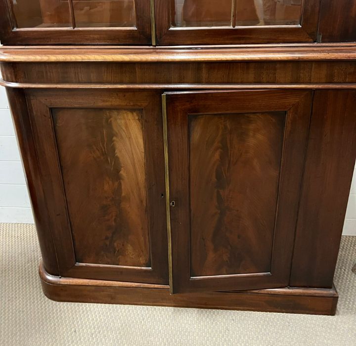 A mahogany glazed bookcase with cupboard under (Base H95cm W110cm D38cm Top H145cm W104cm D33cm) - Image 2 of 5