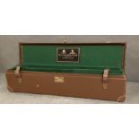 Holland and Holland leather gun case with green felt fitted interior.