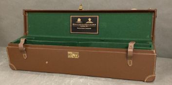 Holland and Holland leather gun case with green felt fitted interior.