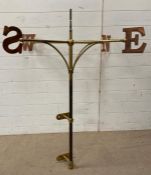 A brass weather vane with cooper compass points (H127cm Dia105cm)