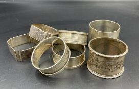 A selection of seven silver hallmarked napkin rings, various hallmarks and makers (Approximate