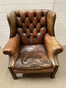 A Chesterfield leather wing back armchair