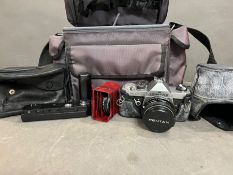 A Pentax Mx Japanese camera with lenses and bag