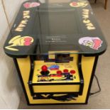 A Pac Man head to head arcade game table