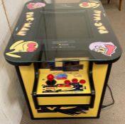 A Pac Man head to head arcade game table