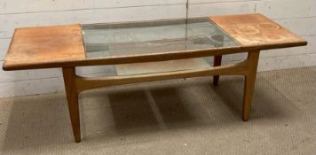 A Mid Century glass topped coffee table with shelf under (H42cm W140cm D52cm)