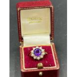An Amethyst and seed pearl ring on 9ct gold Size M1/2 (Approximate weight 3.9g)