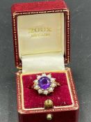 An Amethyst and seed pearl ring on 9ct gold Size M1/2 (Approximate weight 3.9g)