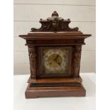 An Edwardian walnut mantle clock