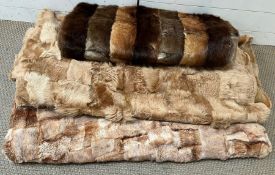 A selection of three various fur throws