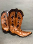 A pair of leather cowboy boots with crocodile logo -size 11
