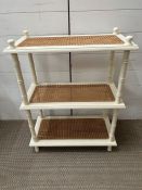 Three tier shelving unit with cane shelves and bamboo style supports (H75cm W60cm D30cm)