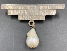 A silver Daisy Choi brooch with seed pearl and inscription 'Everyday is a good day'