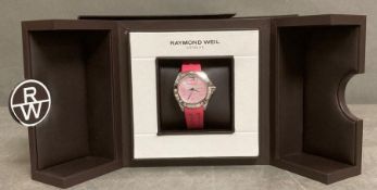 A Raymond Weil Tango with pink dial, original box and papers