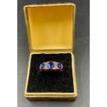 A 9ct gold three stone ring Size J